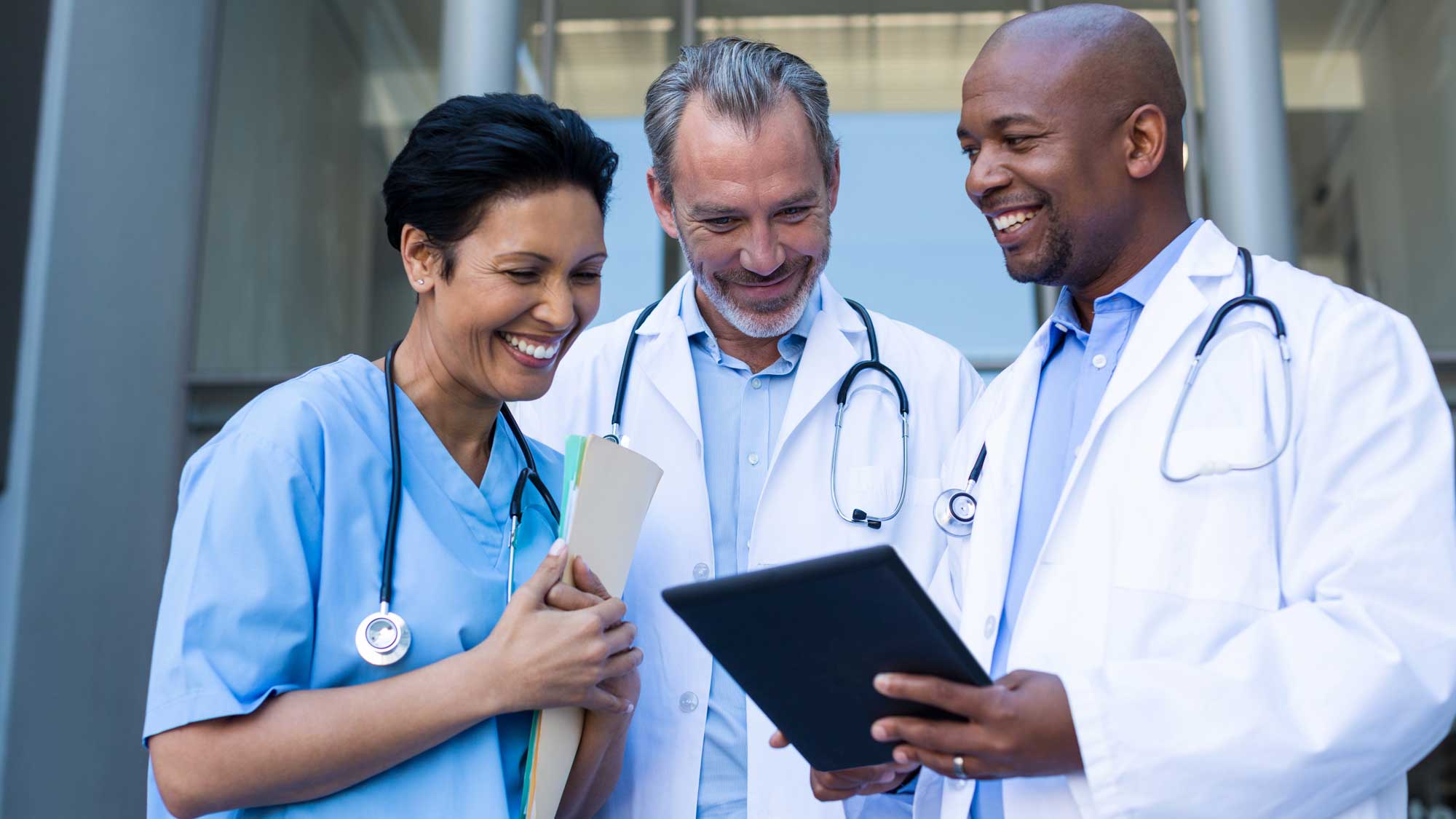 Healthcare staff conferring with consultant