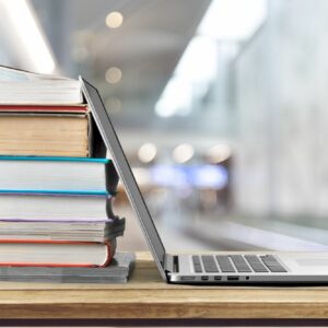 Books and laptop for education