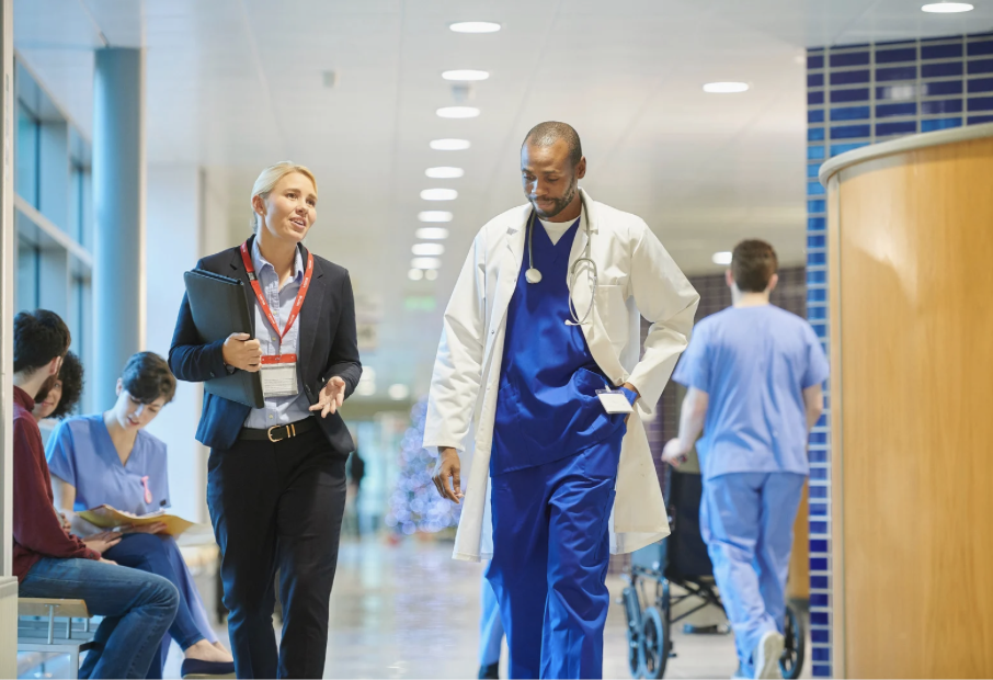 surveyor and hospital staff walking in hospital