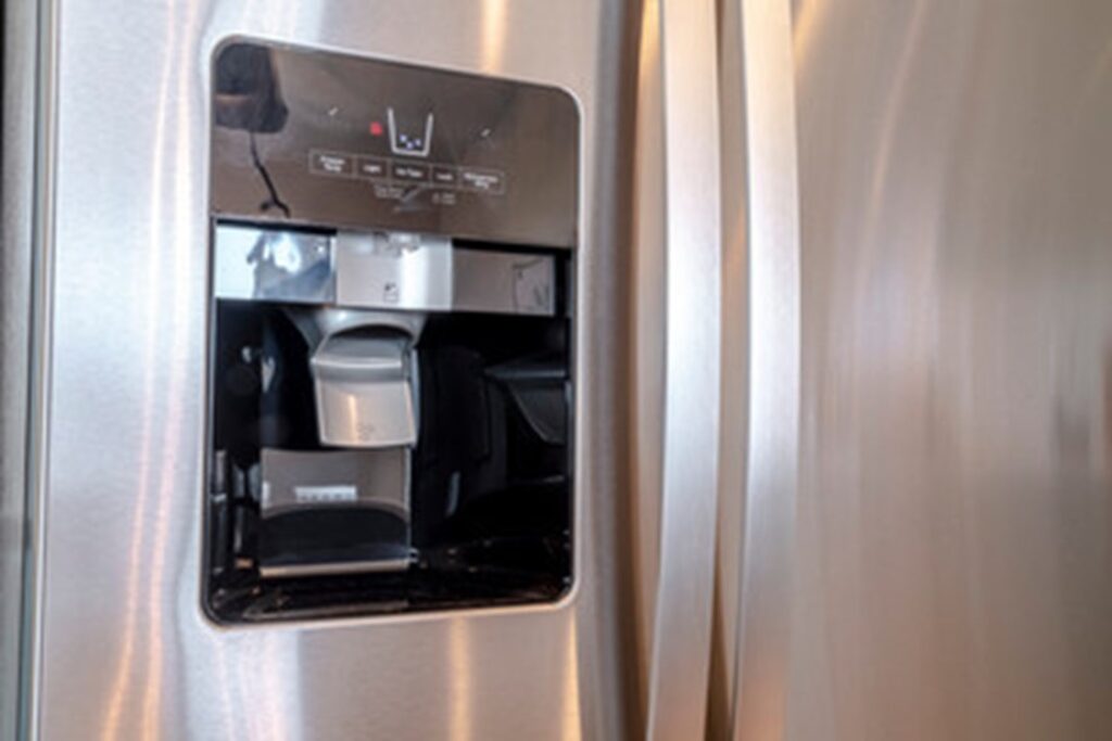 image of a water and ice dispenser on a refrigerator