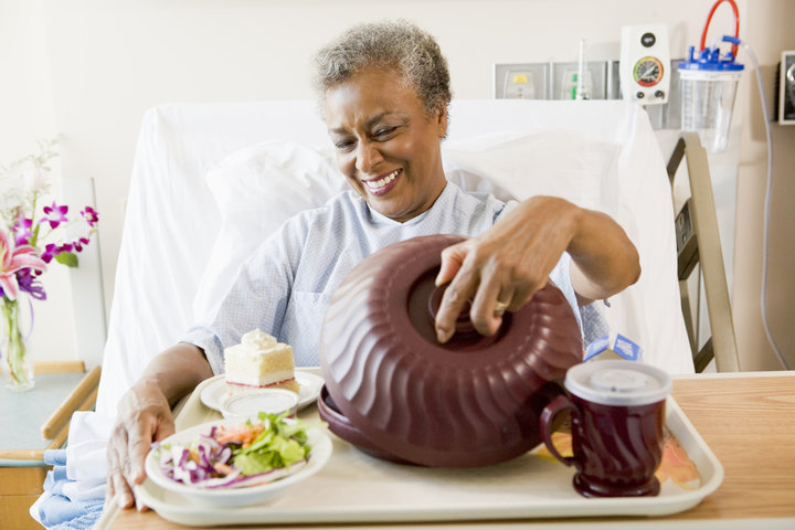Hospital patient receiving meal.