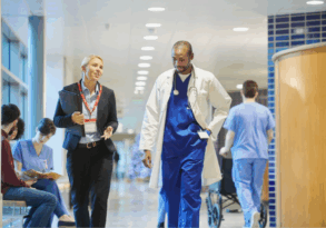 surveyor and hospital staff walking in hospital